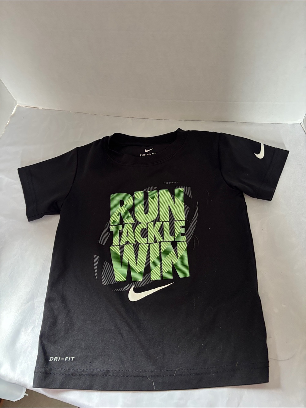 Nike Black Short Sleeve Tee with Green 'Run Tackle Win' Graphic